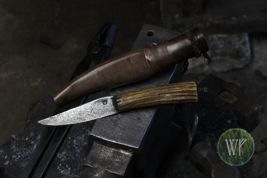 Hand-forged Iron Age style hunting knife with crucible steel blade and antique sambar stag handle