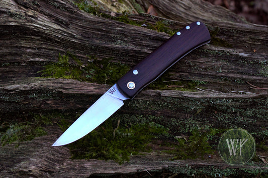 Hand-forged dual-detente folder with 01 Tool Steel blade, Titanium Liners and Rosewood Handle / Non-locking UK Legal Carry