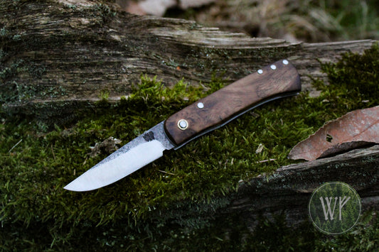 Hand-forged dual-detente folder with 1095 Carbon Steel blade, Titanium Liners and Scottish Oak Burr Handle / Non-locking UK Legal Carry