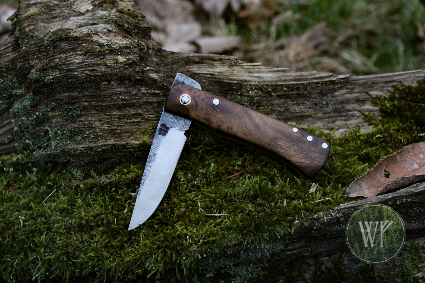 Hand-forged dual-detente folder with 1095 Carbon Steel blade, Titanium Liners and Scottish Oak Burr Handle / Non-locking UK Legal Carry